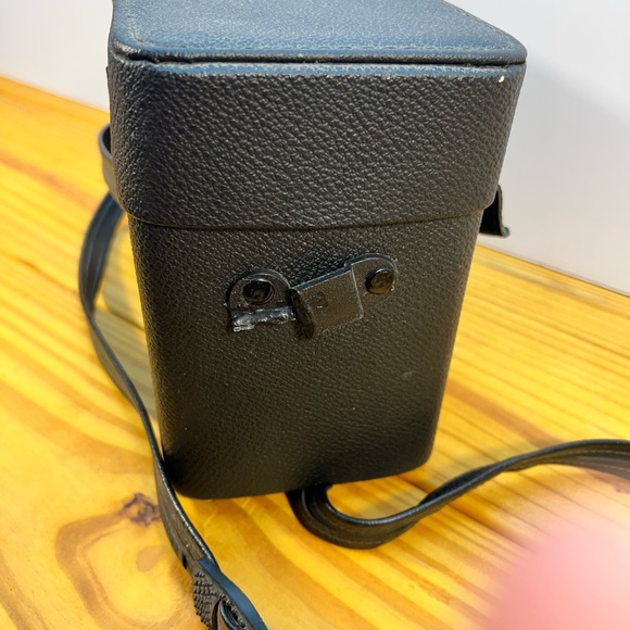 Yashica Black and Silver Film Camera with Rangefinder Design - Picture 8 of 12